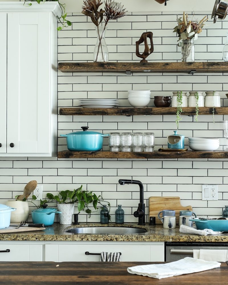 Reclaimed-wood shelving and subway tile in a craftsman-style Vancouver kitchen renovation