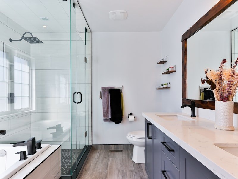 Vancouver bathroom renovation with frameless glass shower and dark vanity